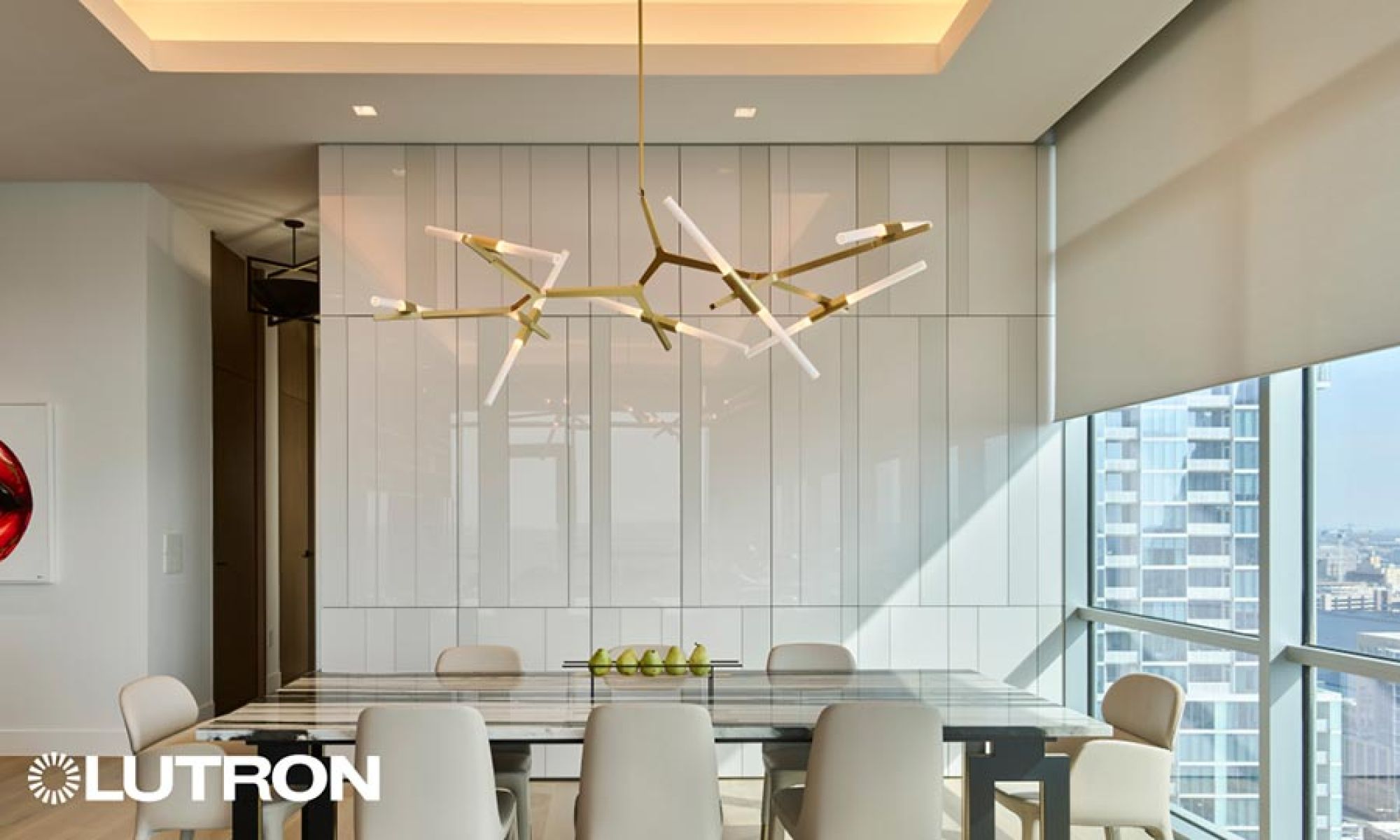 Minimalist dining space with a unique geometric chandelier and large window shades