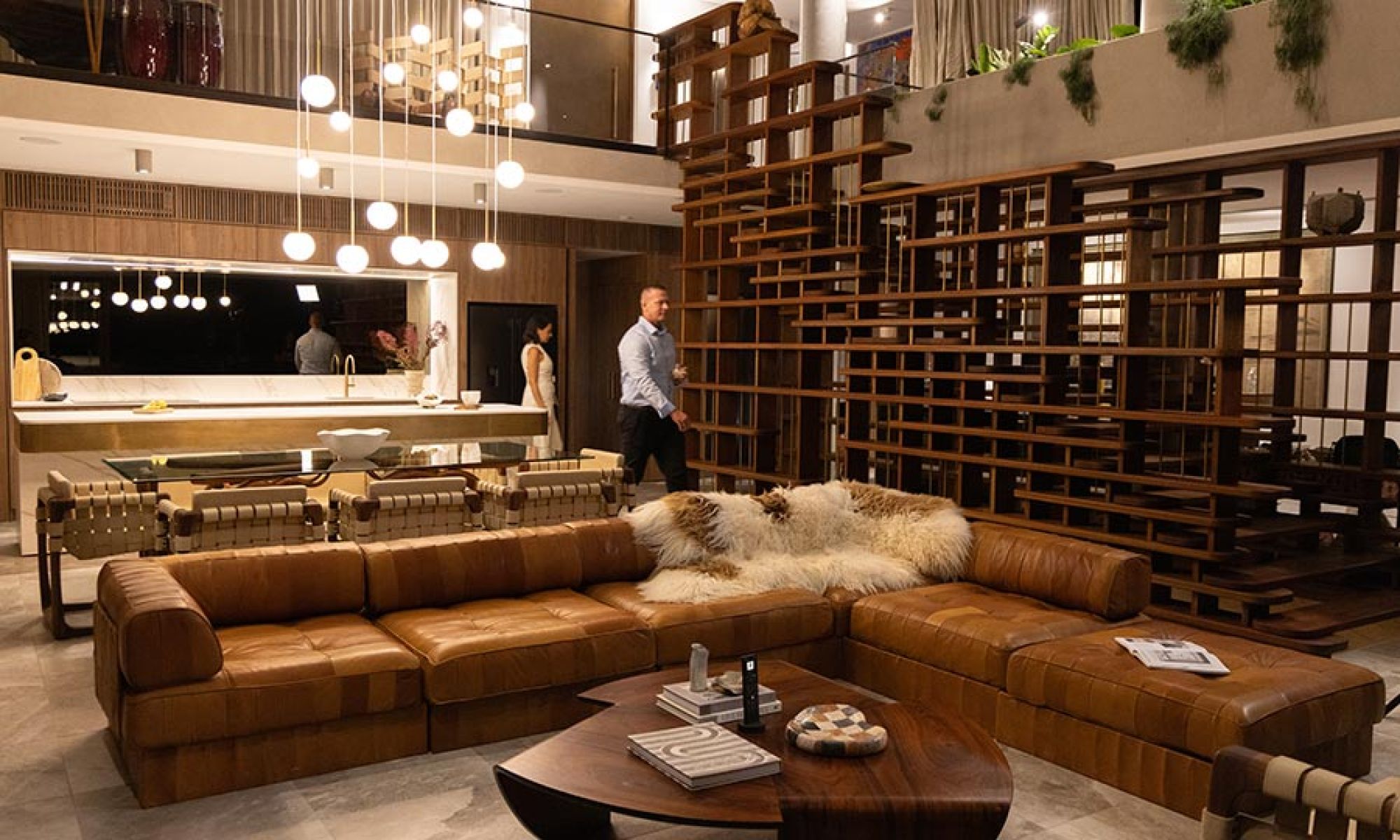 Contemporary living area with leather sofa and decorative wooden shelving